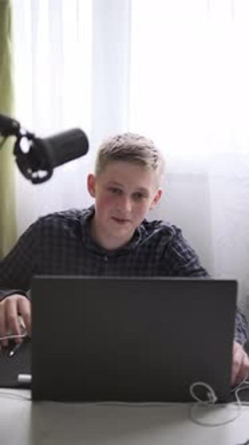 Teenager Studying Online with Laptop and Notebook Distance Learning and Education at Home