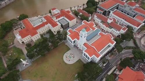 Aerial View of Landmark with Red Tiled Roof and Central Dome in Singapore