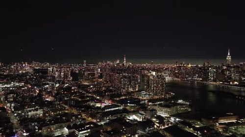 Captivating Views of Queens at Night Showcasing East River and Shimmering Skyline of Midtown