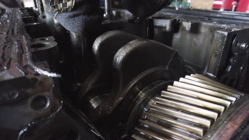 Tractor Engine Repair Close Up in Garage