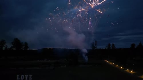 Fireworks Explode over Beautiful Rural Venue at Night