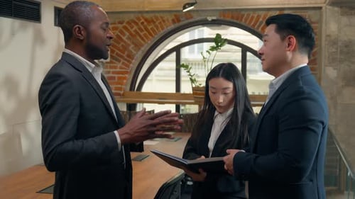 Diverse Team Collaborates in Modern Office Setting