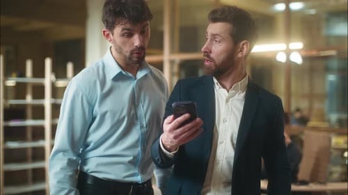 Caucasian Men Businessmen Using Mobile Phone in Office Business Partners Coworkers Male Guys Smiling