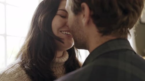 Loving Couple Sharing an Embrace Indoors