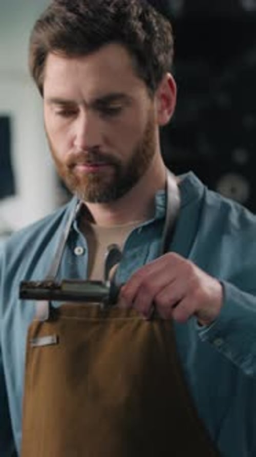 Caucasian Man Barista Work with Roaster Machine on Factory Coffee Roasting Fresh Beans Smelling