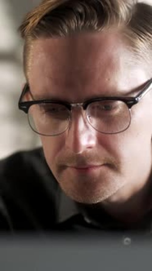 Young Man Freelancer Using Laptop Online Working From Office In Internet Smiling Focused Millennial