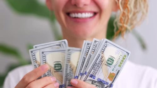 Excited Smiling Woman Showing Cash Money 1000 American Dollars Banknotes Hands with Money Close Up