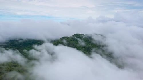 Aerial view morning scenery Mist flowing over the high mountains.