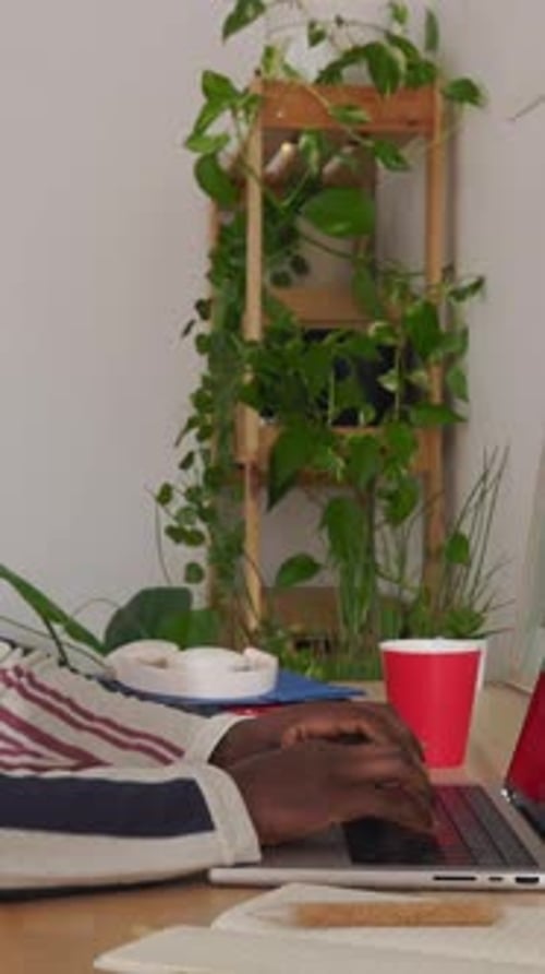 Young Student Black Man Typing on Laptop Studying Online at Home Office