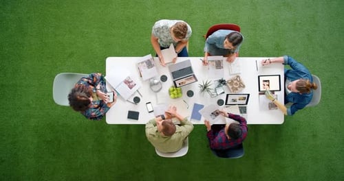 Creative Team Collaborating Around Table at Workplace