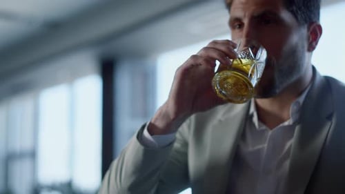 Leader Person Drinking Whiskey in Restaurant Closeup. Handsome Gentleman Portrait Tasting Beverage