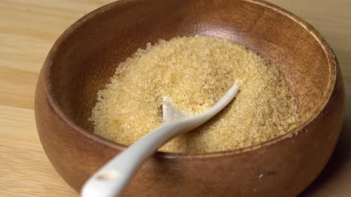 Close-up of Brown Sugar in a Wooden Bowl
