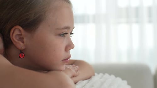 Closeup Side View of Pretty Relaxed Girl Having Neck Shoulder and Back Massage By Unrecognizable
