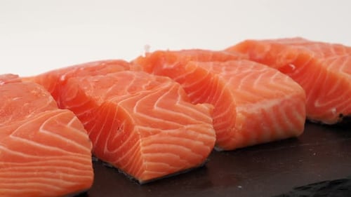 Fresh Salmon Filets on Black Stone Plate