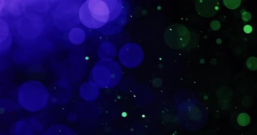 Floating Violet And Green Bokeh Particles