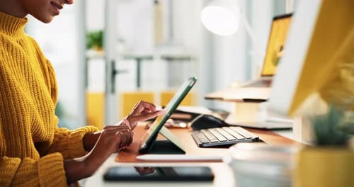 Woman Using Tablet at Office Desk