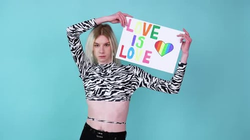 Young Transsexual Transgender Man Holding Paper with Love is Love Message
