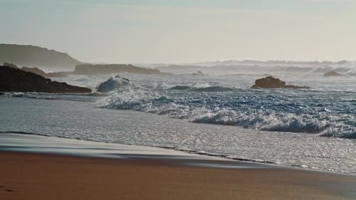 Foaming Waves Washing Sandy Coastline Closeup. Summer Stormy Day Sea