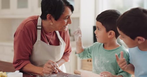 Grandmother and Children Baking Together in Kitchen