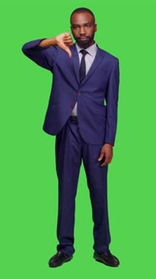 Vertical Video Front View of Negative Office Worker Doing Thumbs Down in Studio