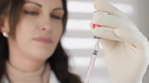 The Beautician Collects Botulinum with a Syringe Injection As a Painless and Quick Way to Inject a