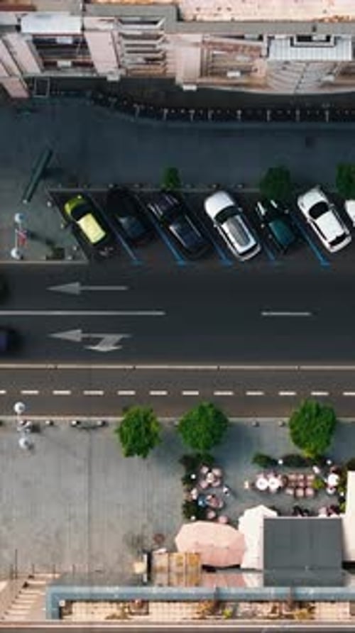 Aerial drone view of cars moving in traffic through Bucharest, Romania. Vertical