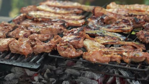 Home barbecue grilling of pork belly on charcoal grill, Mahe, Seychelles 1 30fps