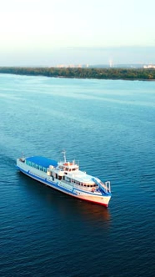 Passenger Ferry Navigating Calm River at Sunrise Clip