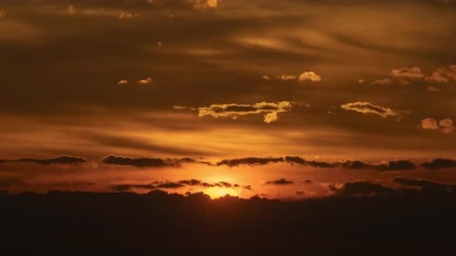 Golden Sunrise Breaking Through Dark Clouds