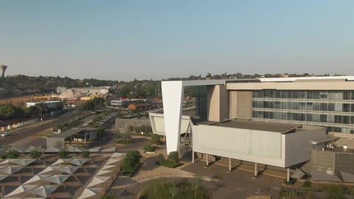 Drone aerial footage of a Modern Office building with a big arch