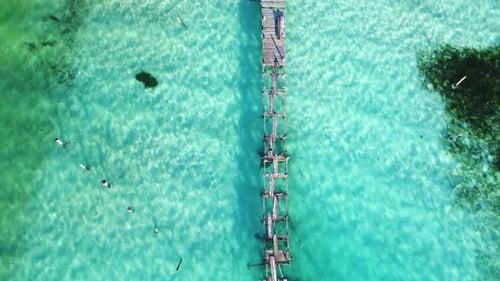 Aerial drone shot of broken wooden pier mexico Bacalar - Aerial view above a wooden pier at the Baca