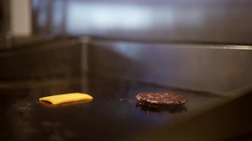 Process of Cooking Cheeseburger in Fast Food Restaurant Closeup View of Roasting Beef Cutlet