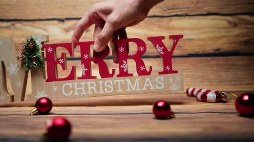 Merry Christmas Sign on a Wooden Background