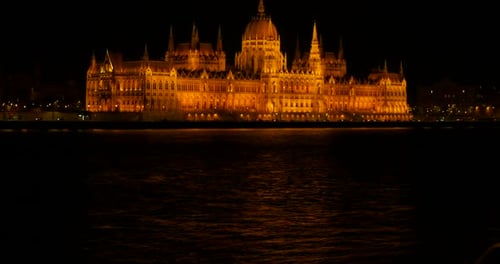 Parliament Lights in Night Against Danube
