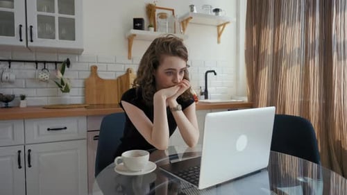 Tired Woman Listens to Boring Online Lecture Closing Laptop