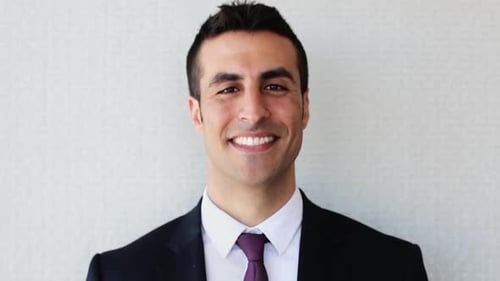Smiling Young Businessman in Suit Posing for Portrait