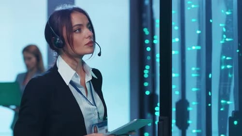 Woman with Tablet in Futuristic Server Room