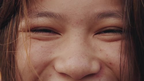 Close-Up of Young Woman's Smiling Face
