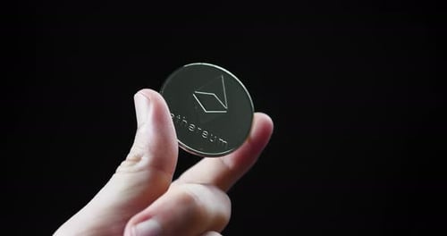 Hand Holding Ethereum Coin, Close Up