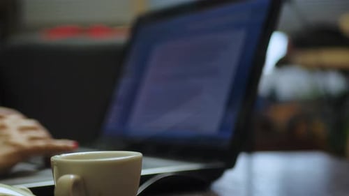 Real woman work at home office, female freelancer. Working at home during pandemic. Typing on keyboa