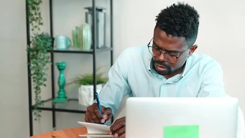 Freelance Man Working with Computer