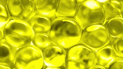 Yellow spheres gently moving and reflecting light