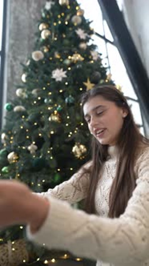 Woman Receives Christmas Gift with Dog and Friend