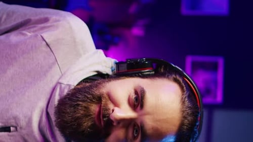 Man Wearing Headphones Playing Video Game