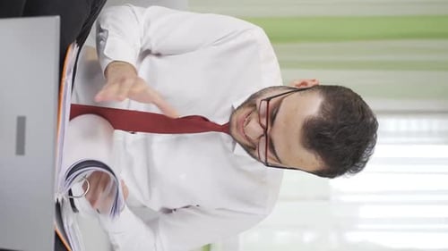 Frustrated Young Adult Man Working In The Office