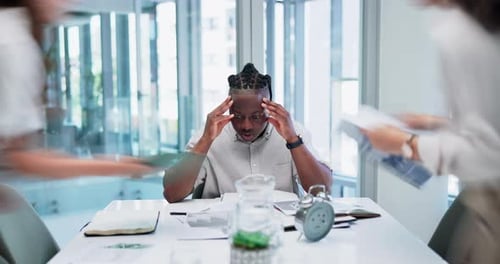 Overwhelmed businessman with headache, anxiety or stress with crisis, fatigue