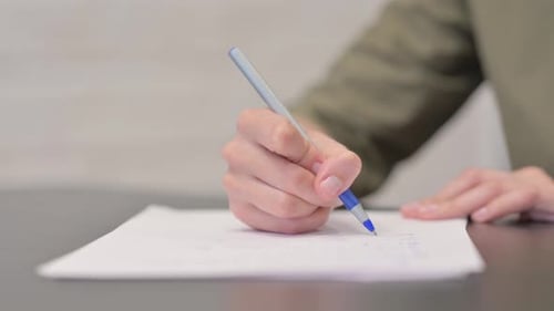 Close up of Businessman Hand Writing a Letter