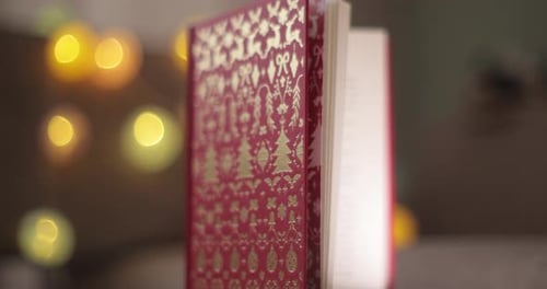 Festive Red and Gold Book with Christmas Lights