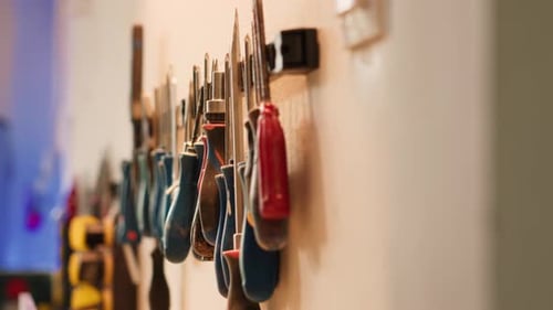 Close Up of Various Woodworking Tools on Rack Panning Shot