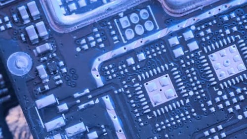 Microchip and microprocessors, top view. Computer PC chip blue light close up.